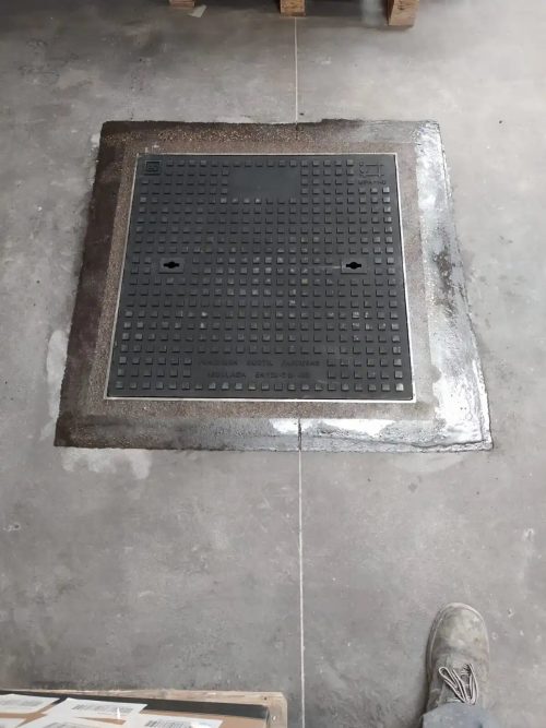 Arqueta de un almacén industrial tras ser reparada